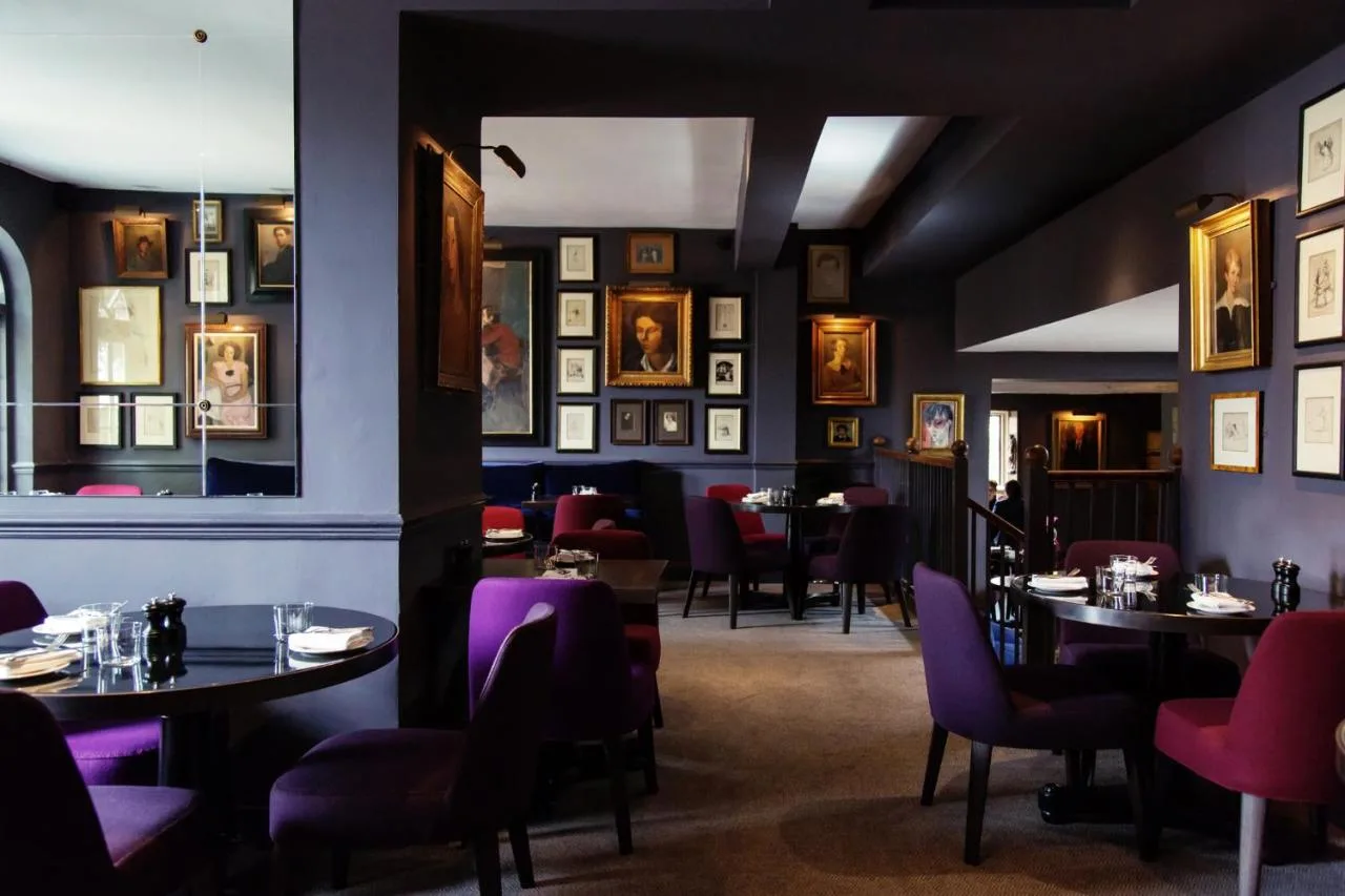 Restaurant seating and artwork at Old Parsonage Hotel, Oxford